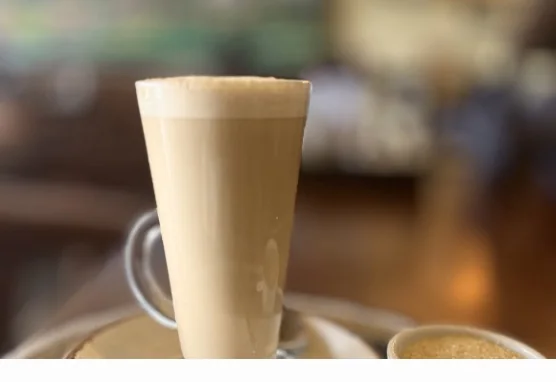 A tall caramel-coloured latte at Coffee Culture